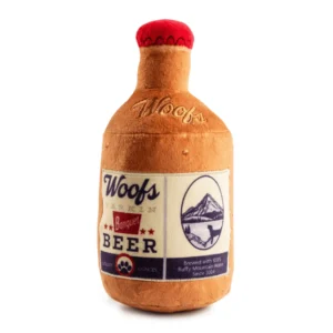 Plush brown beer bottle dog toy with tan Woofs Beer label and red cap