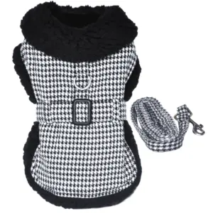 a black and white dog coat with a houndstooth pattern, sherpa collar and lining with matching leash