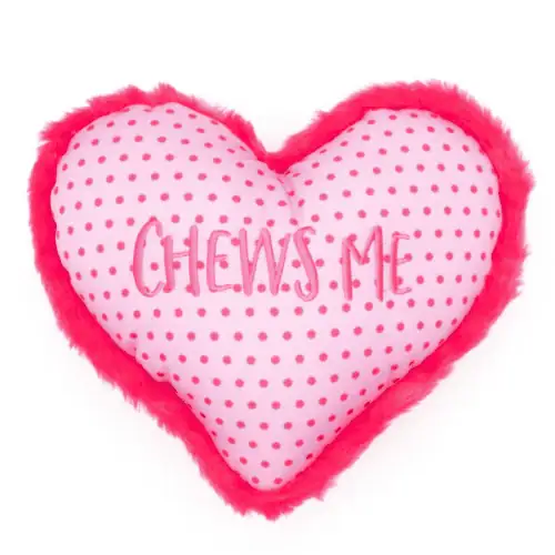 Pink heart dog toy with hot pink polka dots and hot pink fur trim with "Chews Me" embroidered in the center